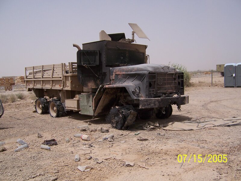 Damaged military truck in desert