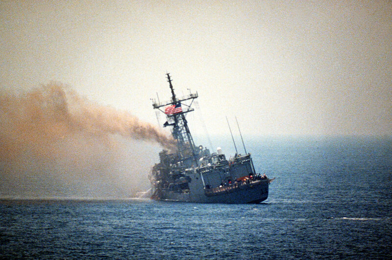 Damaged naval ship at sea