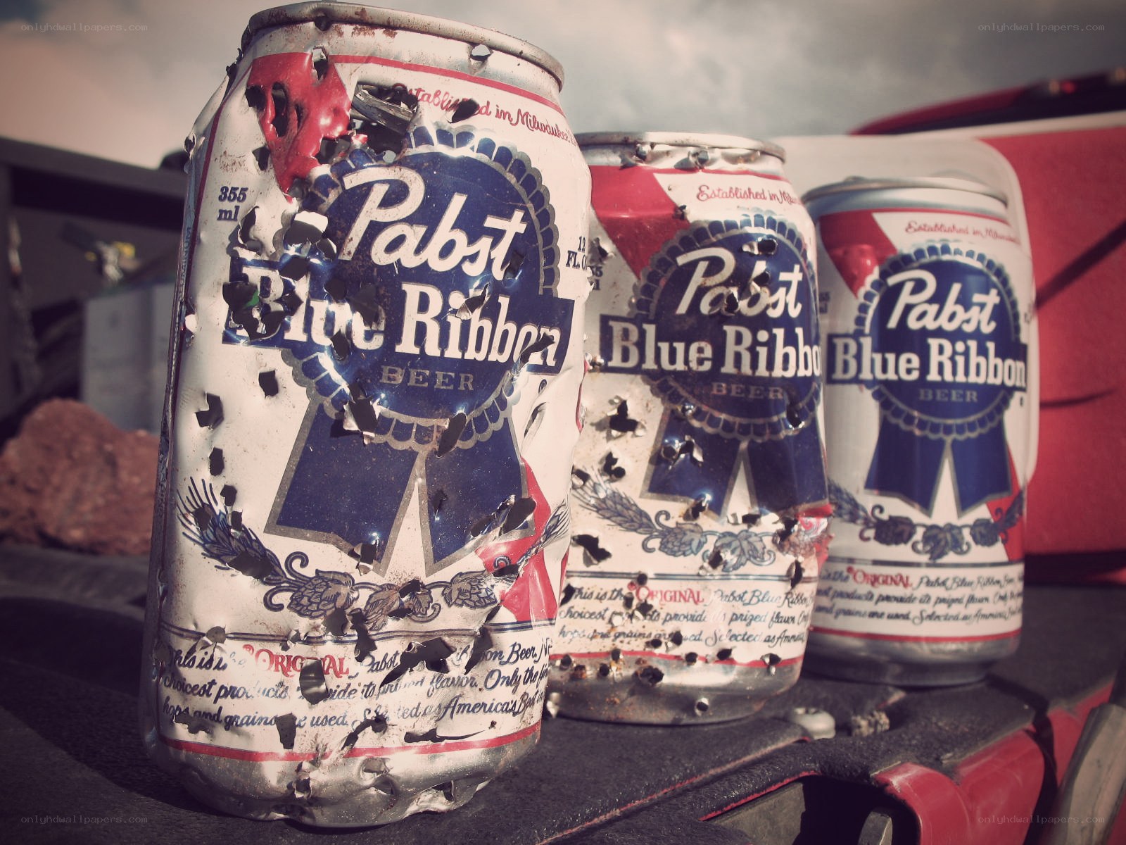 Damaged Pabst Blue Ribbon cans