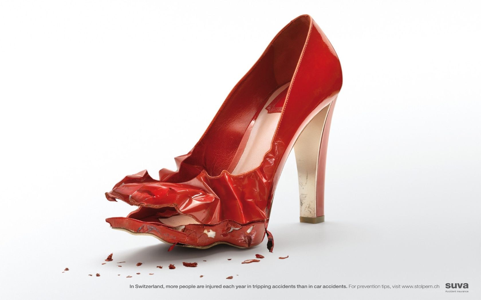 Damaged red high heel shoe