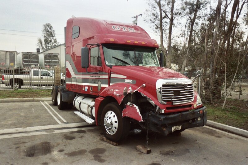 Damaged Red Semi-truck