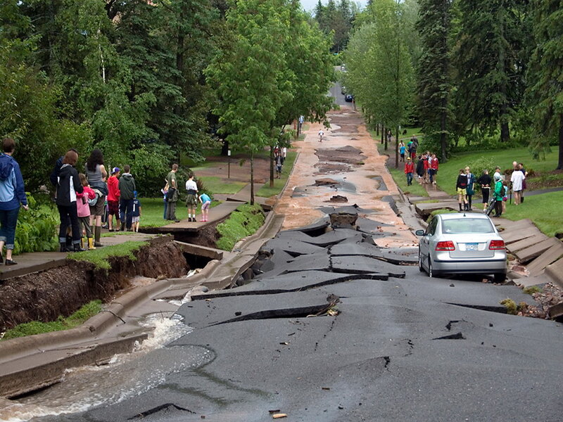 Damaged Road with People