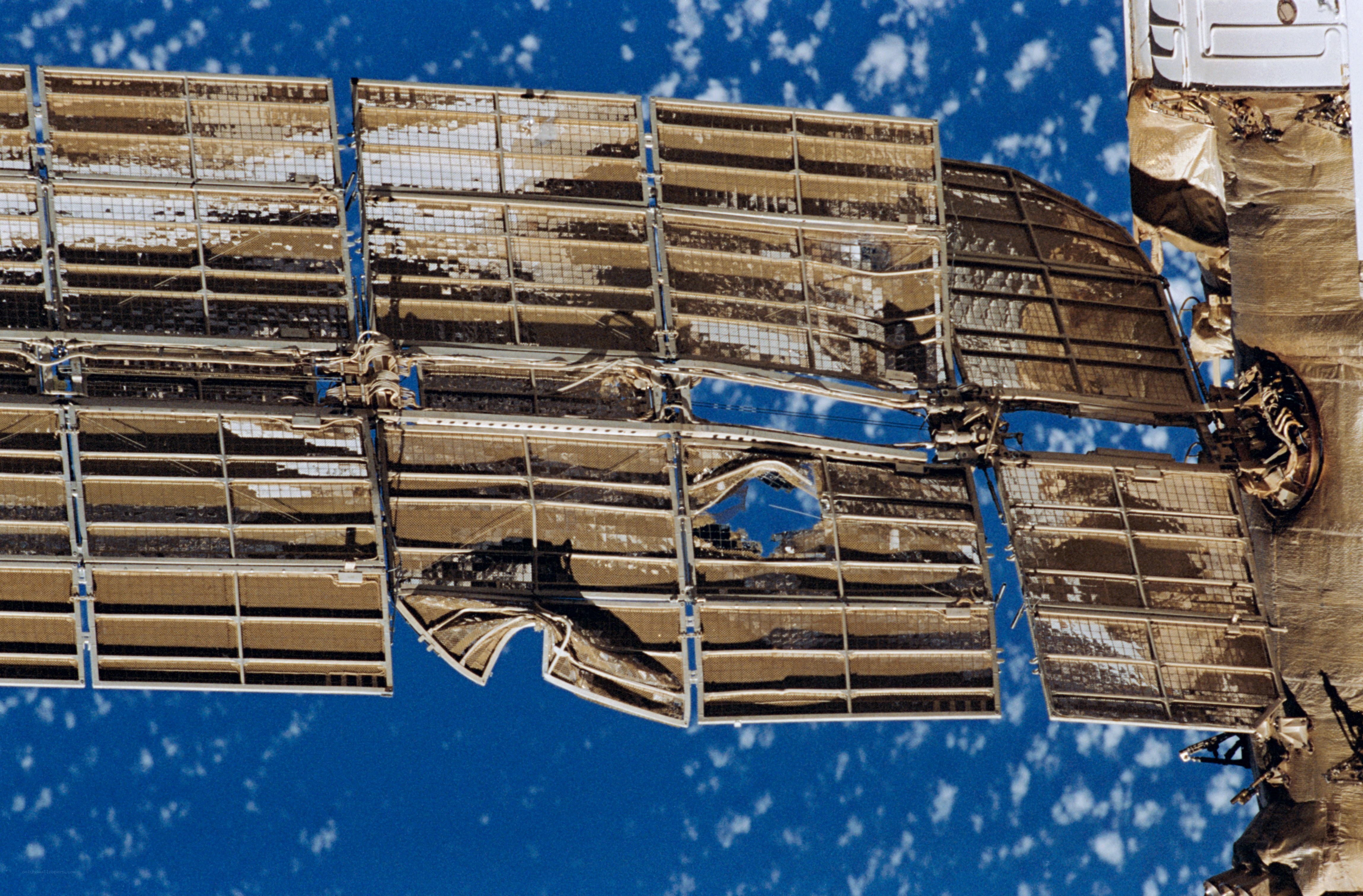 Damaged solar arrays in space