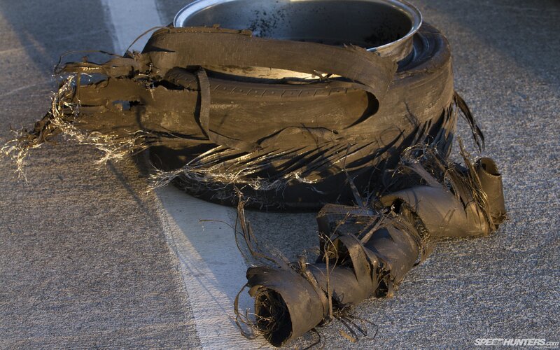 Damaged tire on pavement
