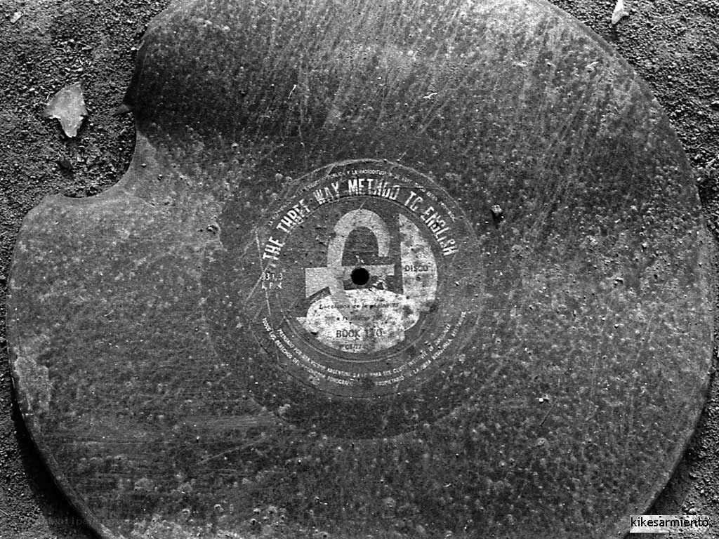 Damaged vinyl record on ground