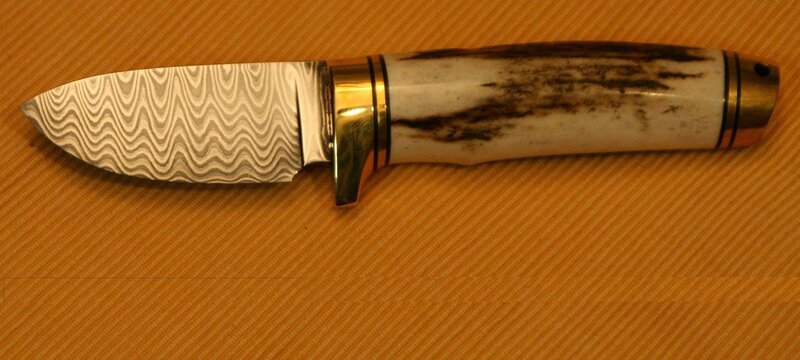 Damascus steel knife with antler handle
