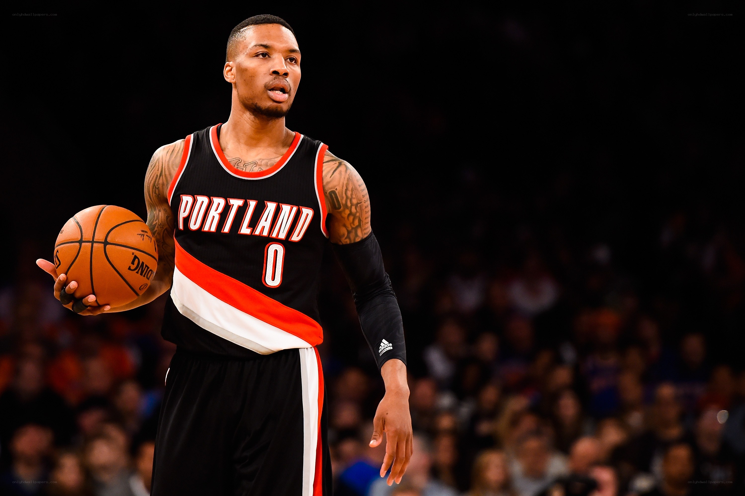 Damian Lillard holding basketball