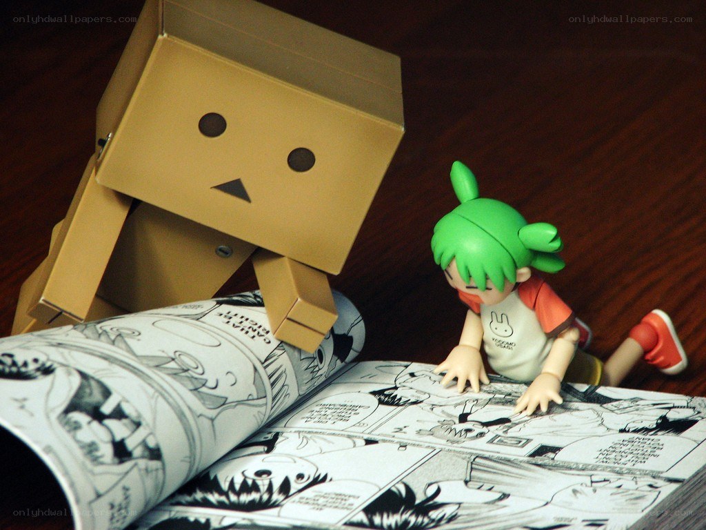 Danbo and a figurine reading comics