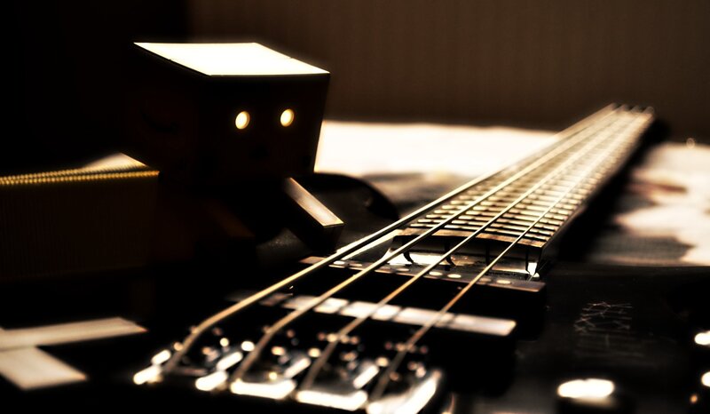 Danbo Figure on Bass Guitar