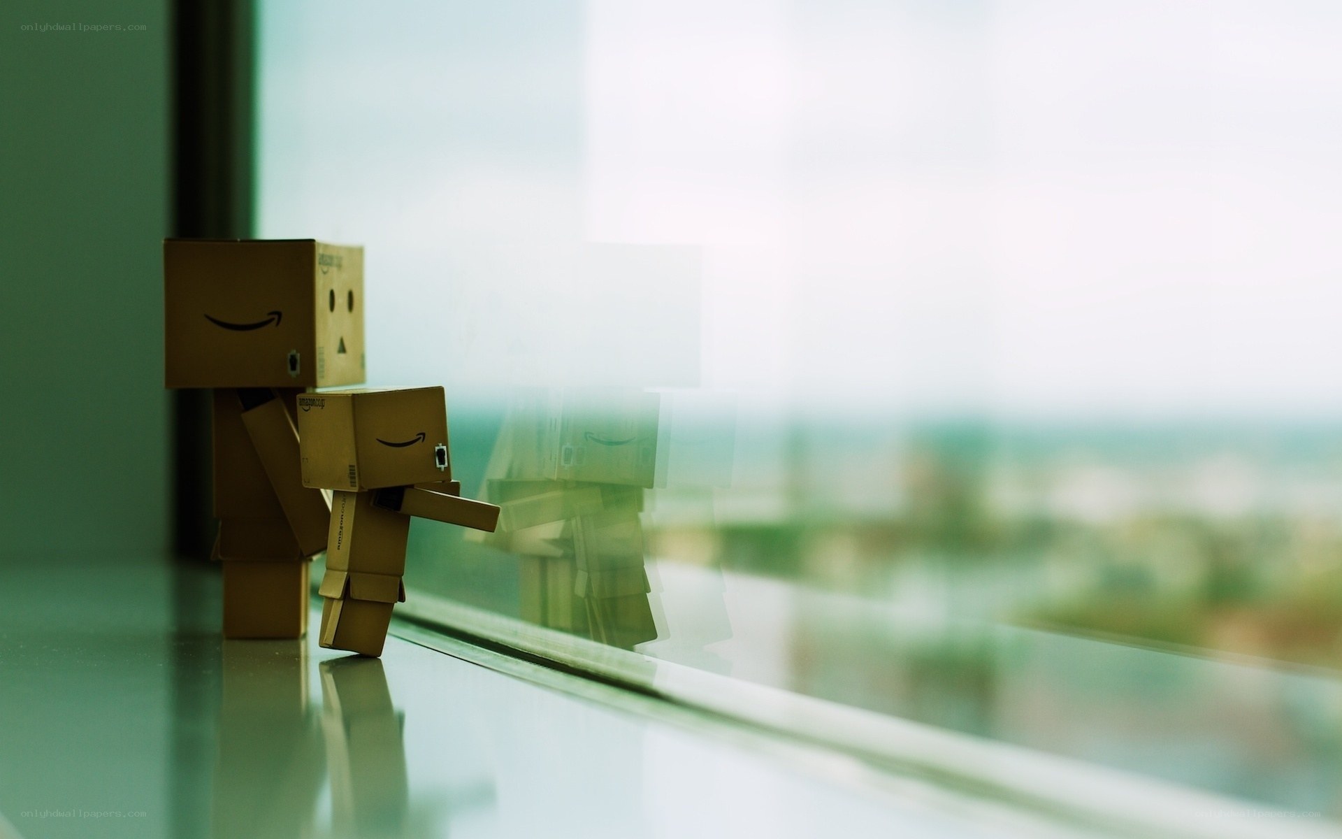 Danbo figures by a window
