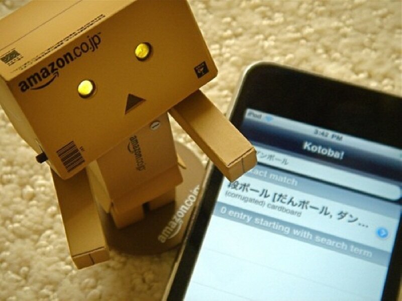 Danbo robot next to smartphone
