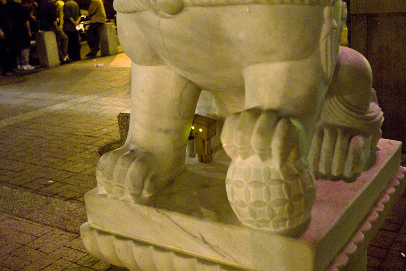 Danbo under a stone lion