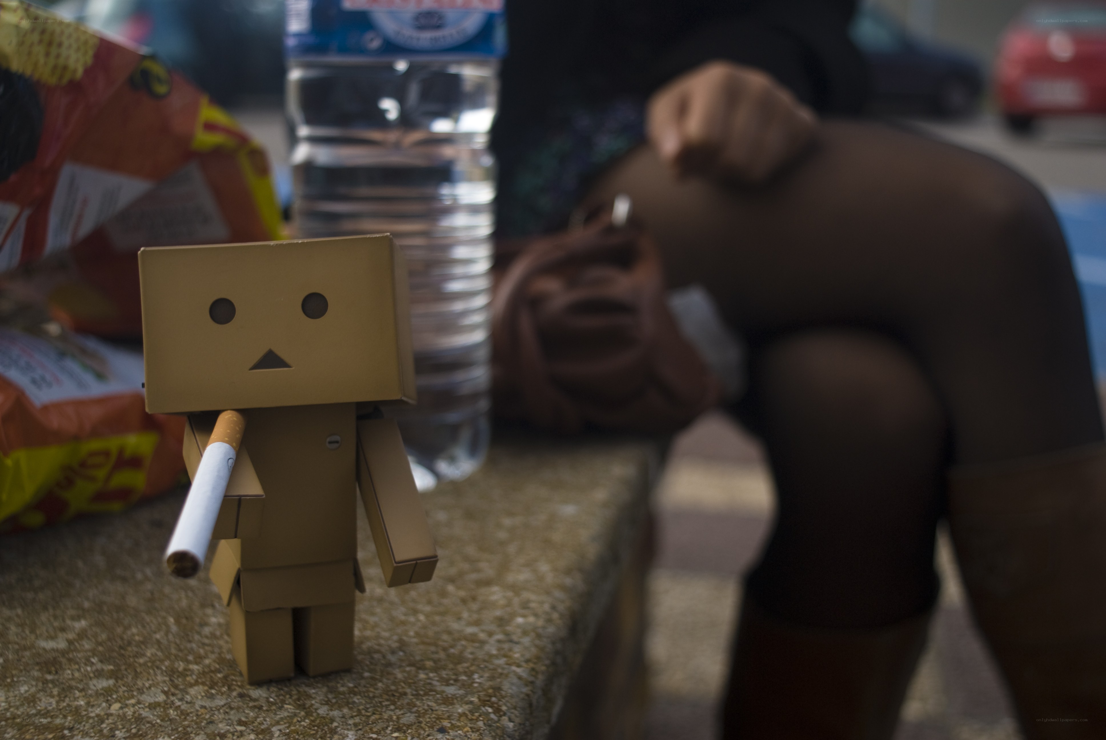 Danbo with cigarette on a ledge