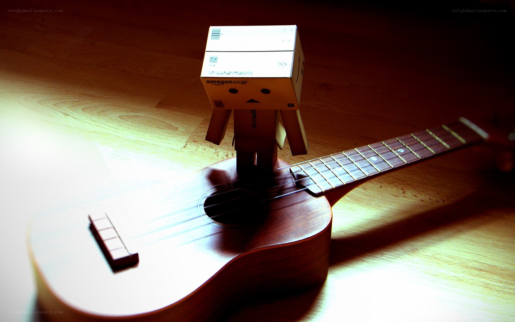 Danbo with ukulele on wood