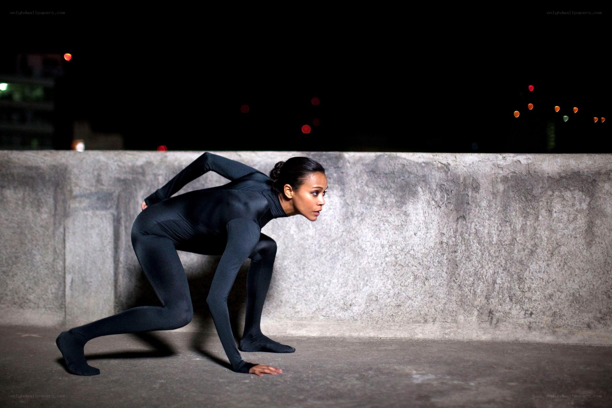 Dancer in black suit at night