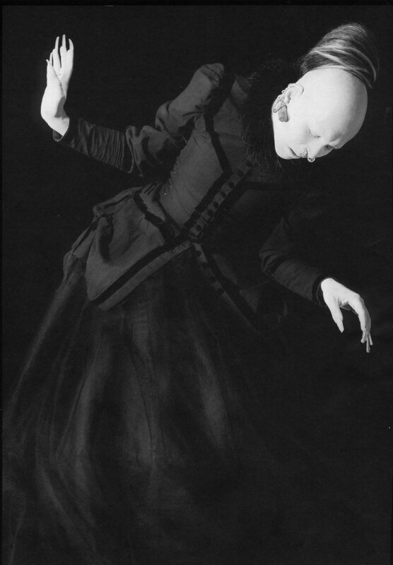dancer in dark costume