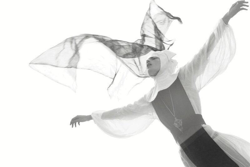 dancer in flowing white fabric
