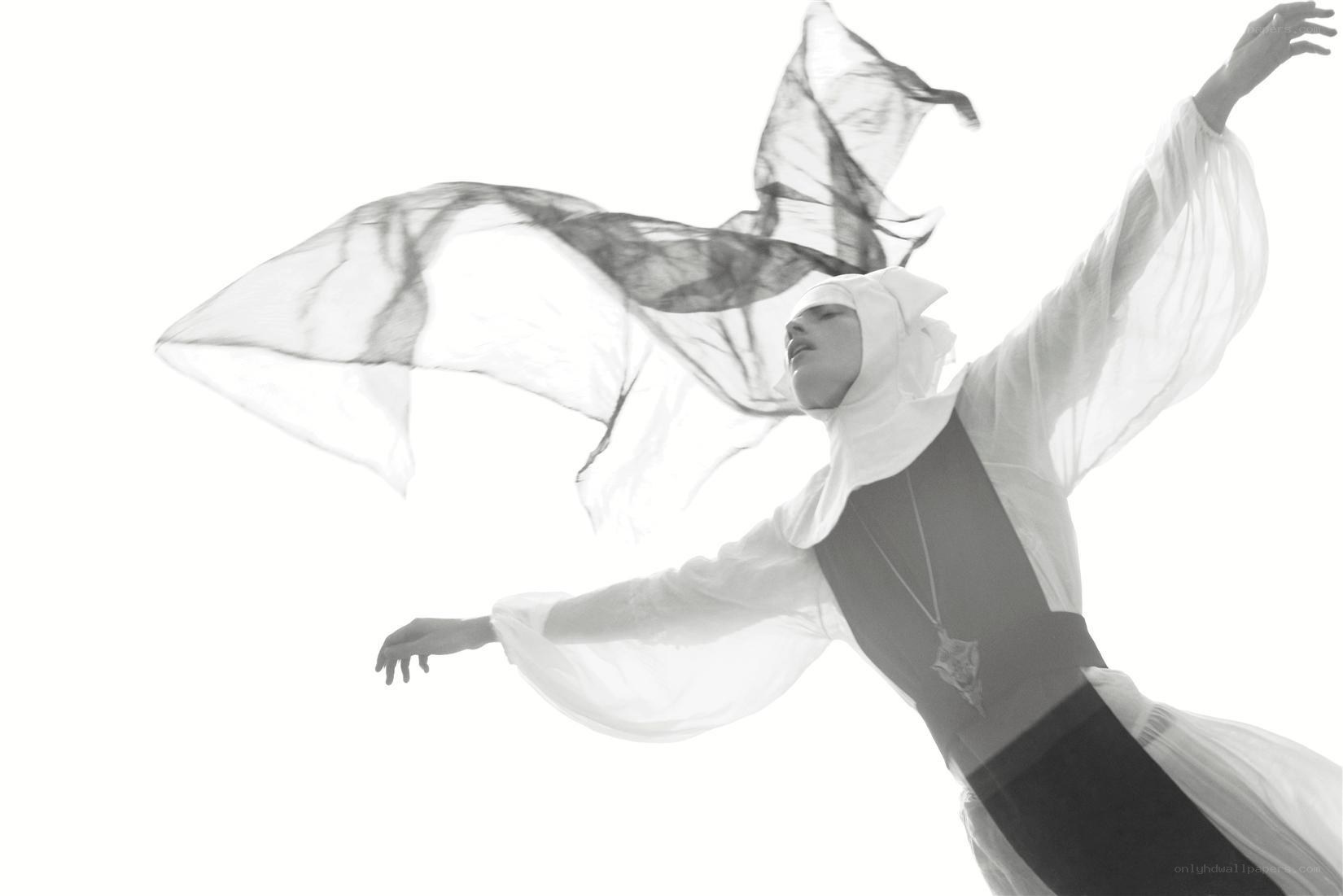 dancer in flowing white fabric