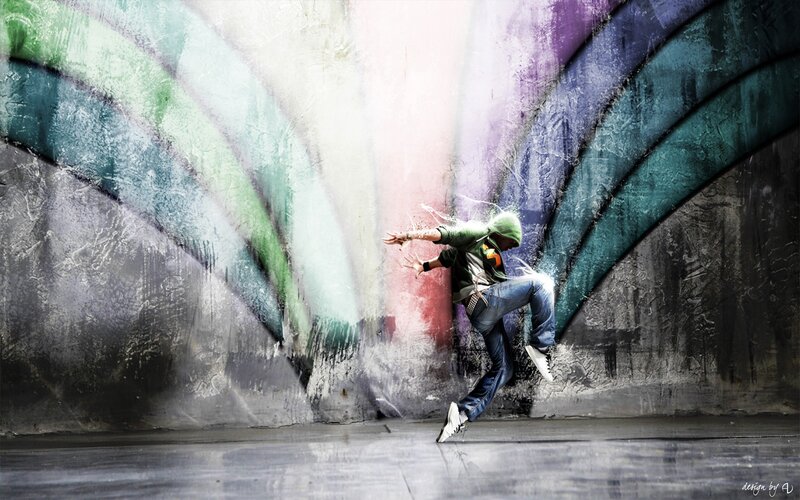 Dancer in front of colorful wall