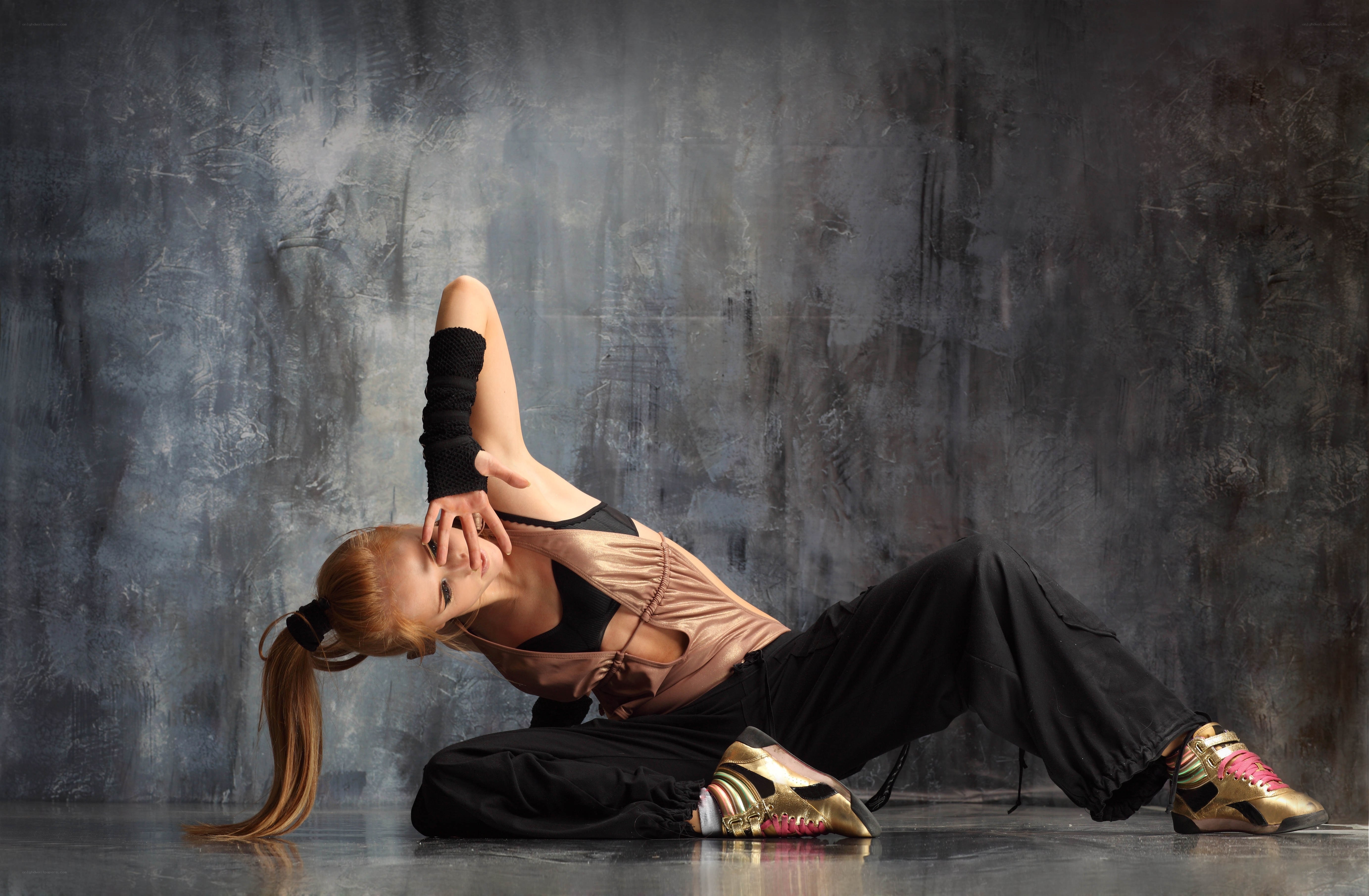 dancer in gold sneakers