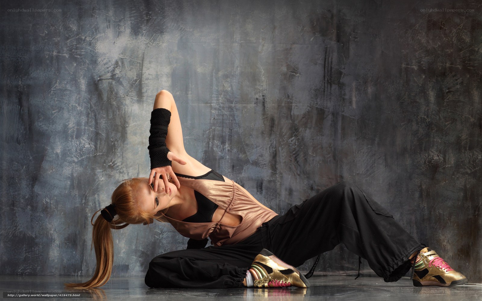 dancer in gold sneakers