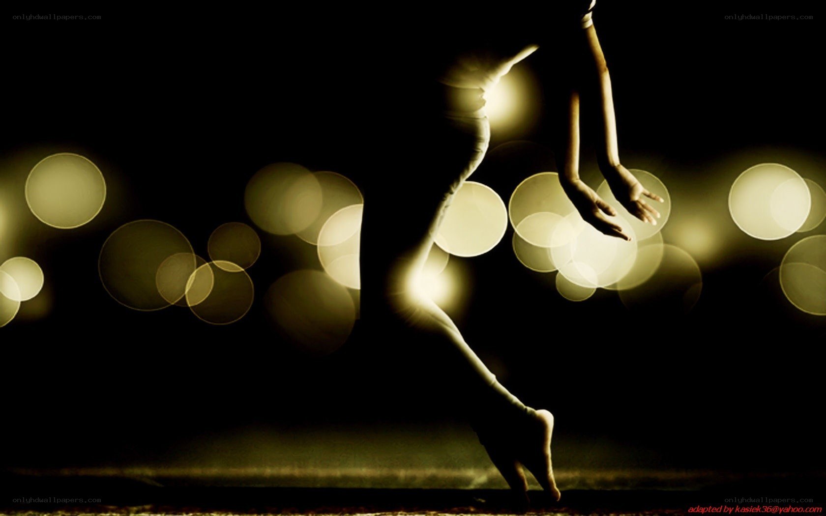 dancer in motion with bokeh lights