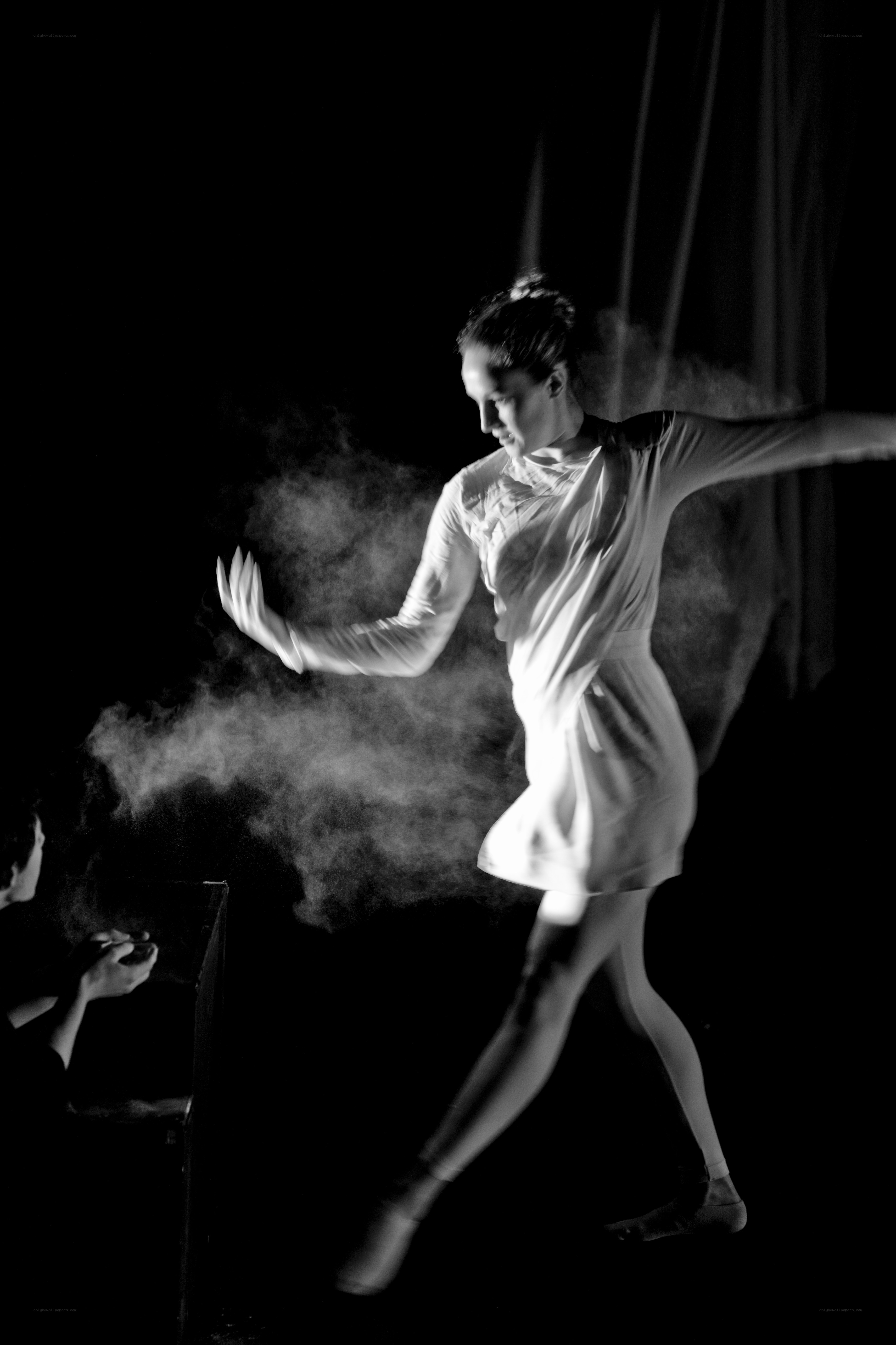 Dancer in motion with smoke