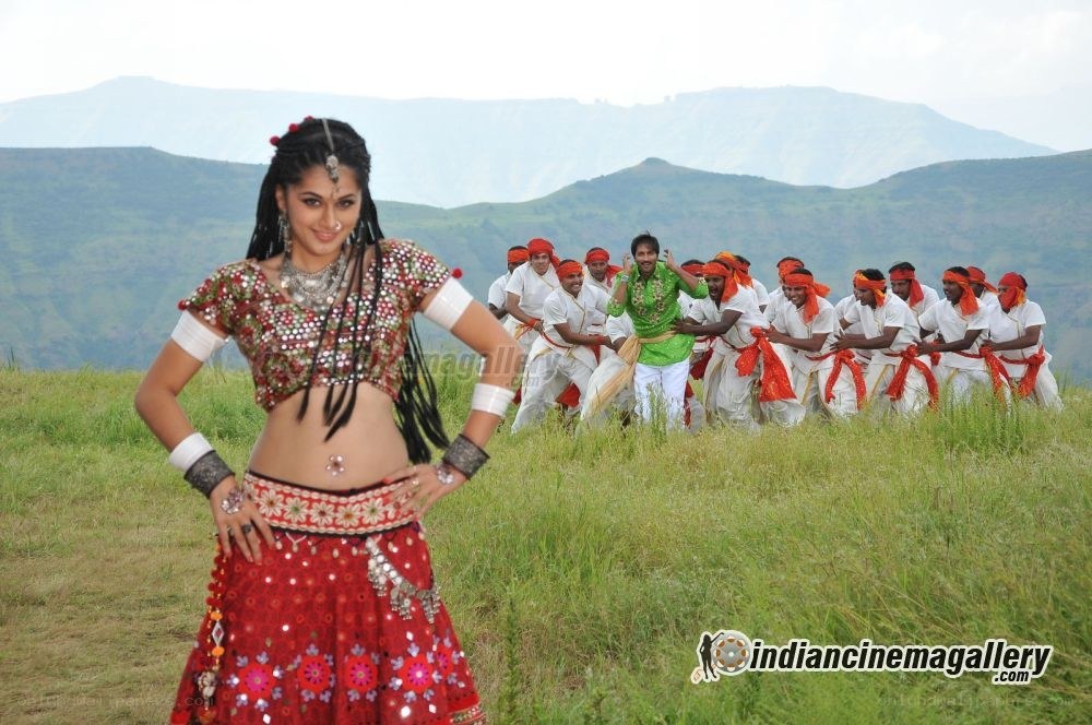 Dancer in red with group behind