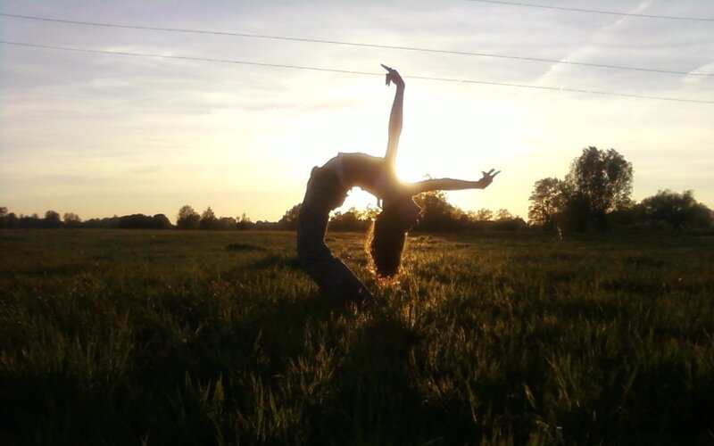 Dancer in sunset field