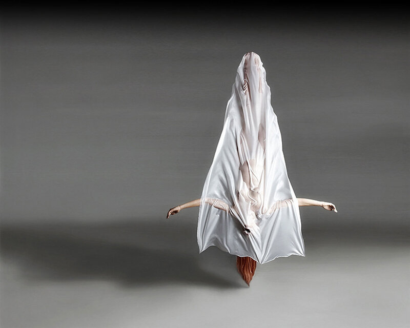 dancer in white fabric costume