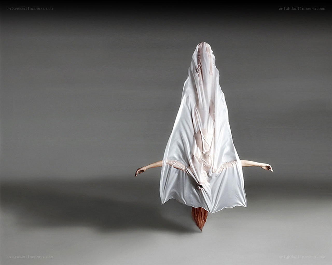 dancer in white fabric costume