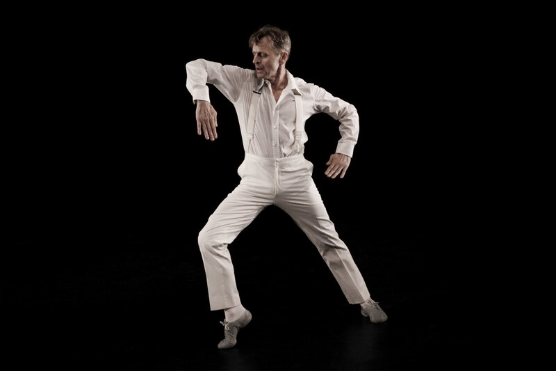 dancer in white on black