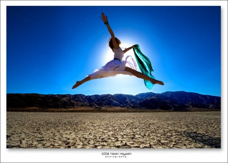 Dancer leaping in desert