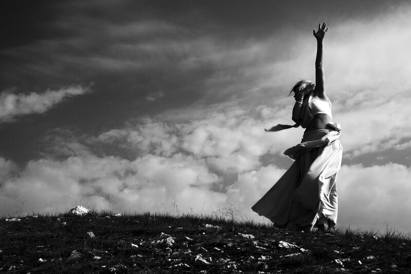 Dancer on a hill at sunset
