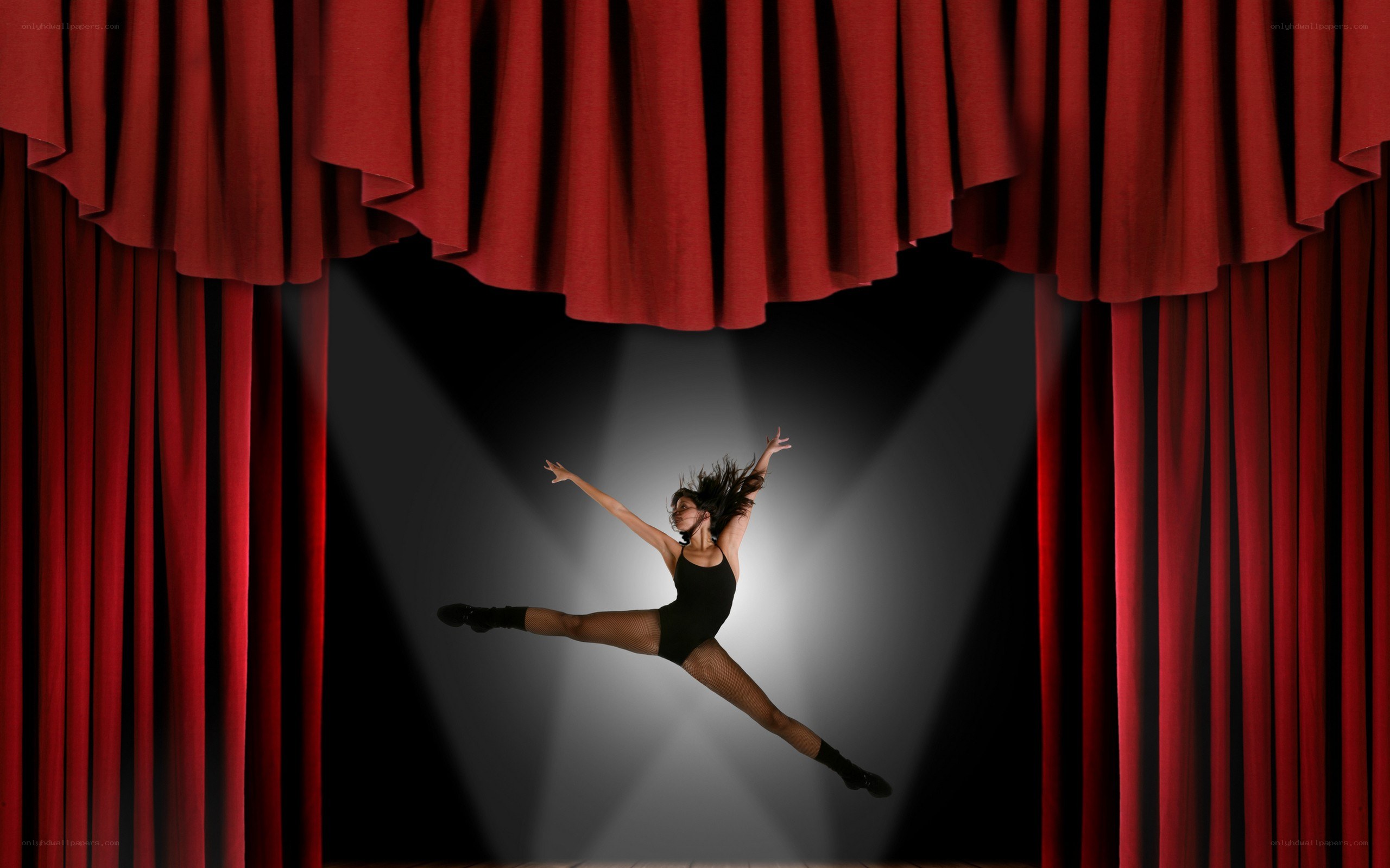 dancer on stage under spotlight