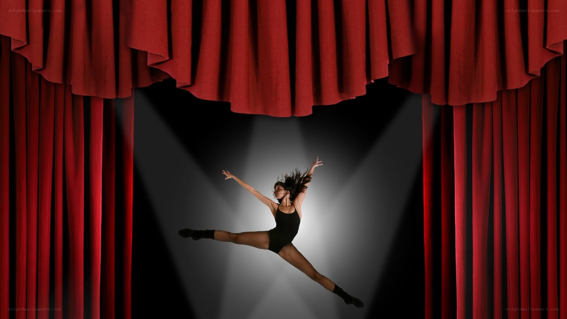 Dancer on stage under spotlight