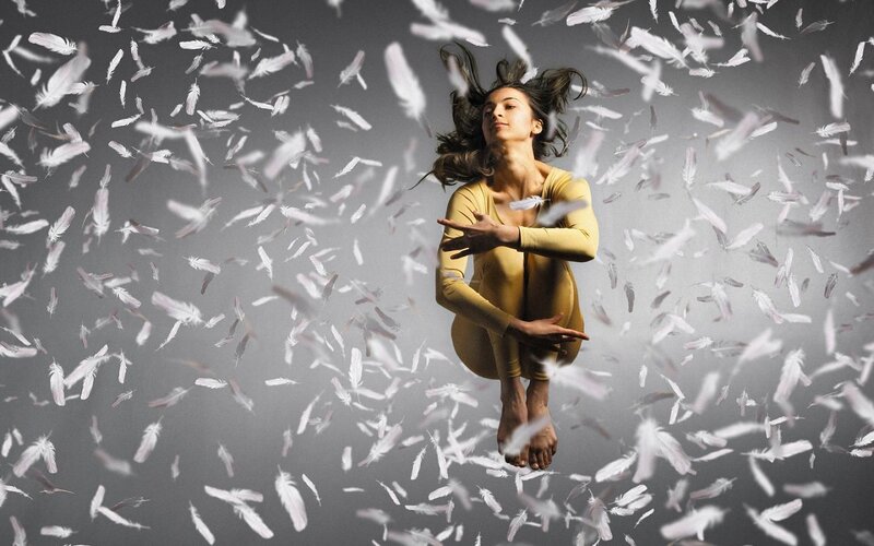 Dancer Surrounded by Feathers