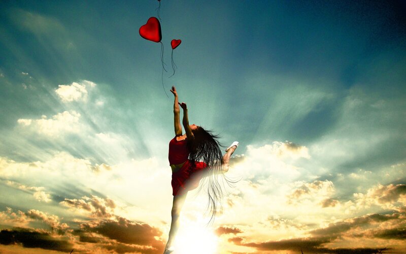 Dancer with heart balloons