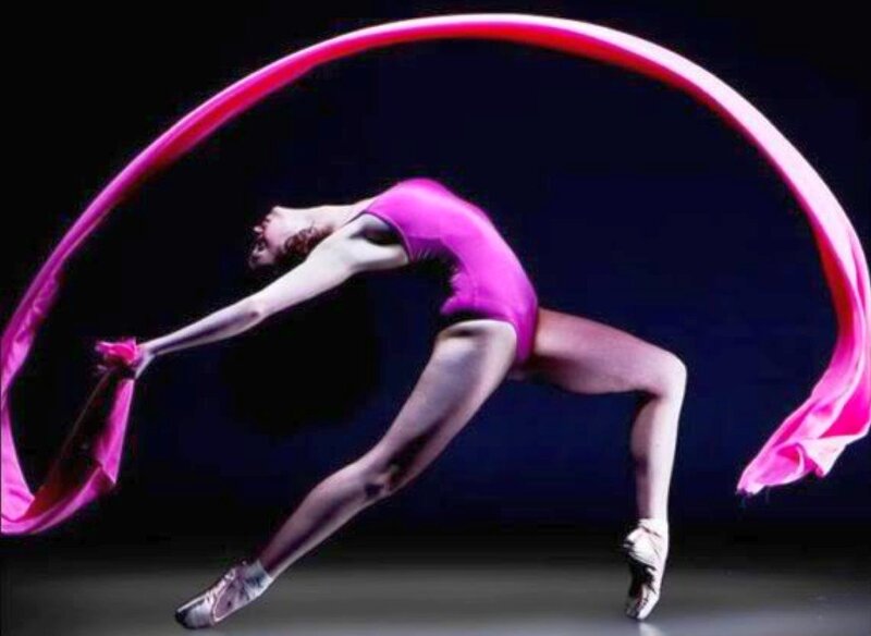 Dancer with pink ribbon