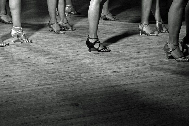 dancers' feet on a wooden floor