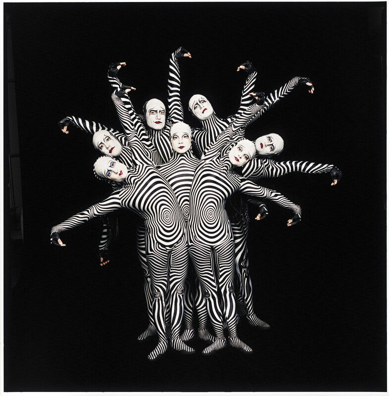 Dancers in black and white costumes