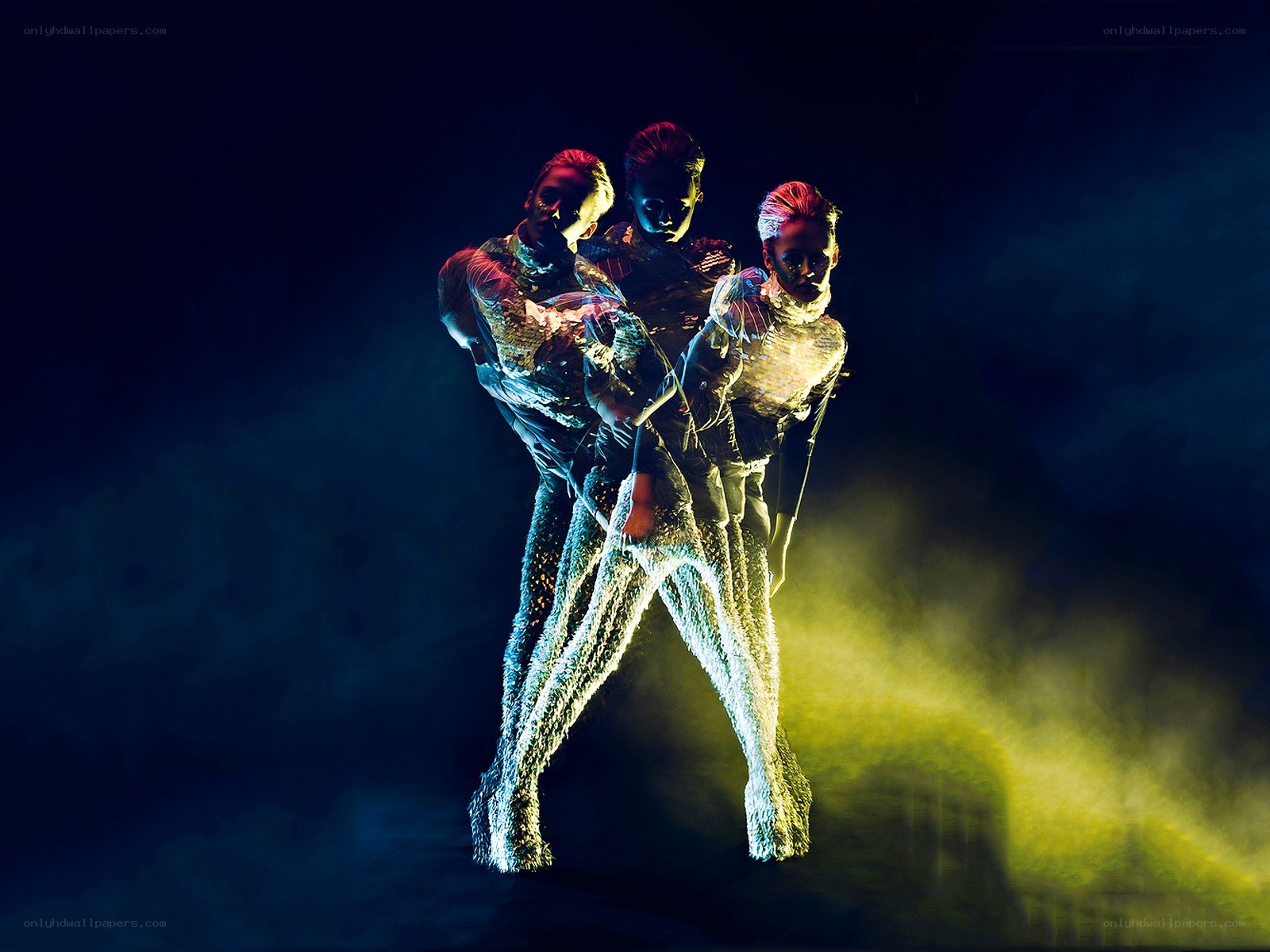 Dancers in glowing costumes
