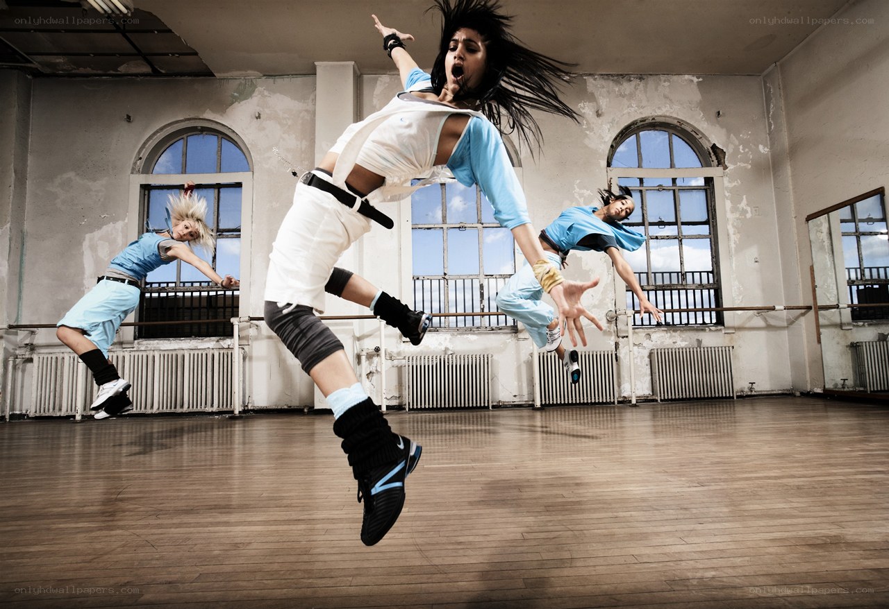Dancers in mid-air jump