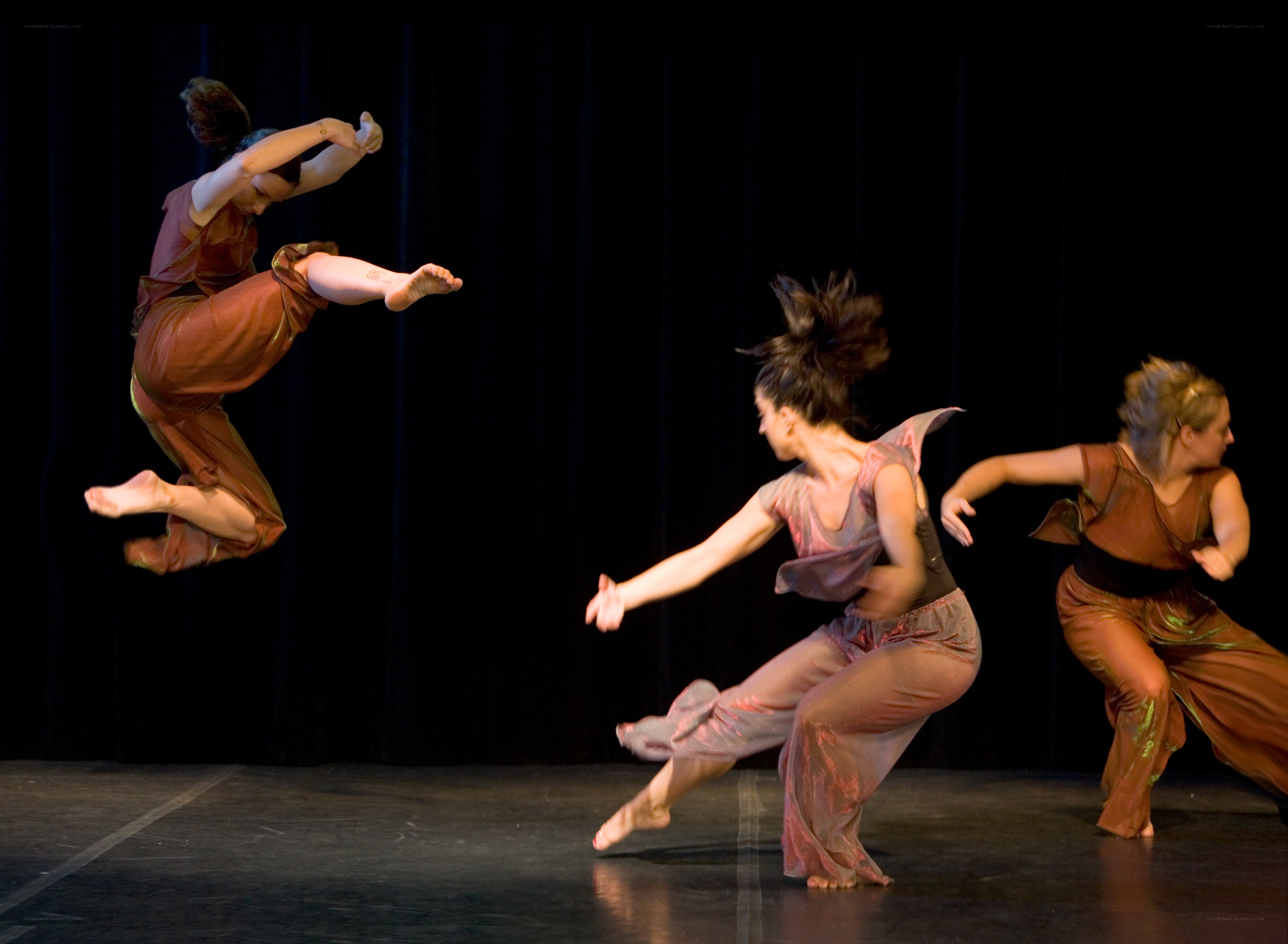 Dancers in motion on stage