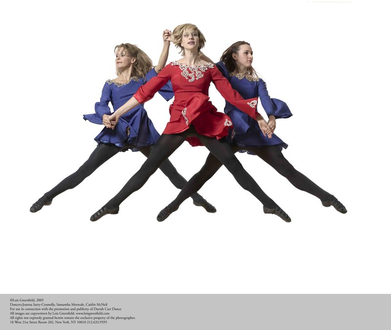 Dancers in red and blue costumes