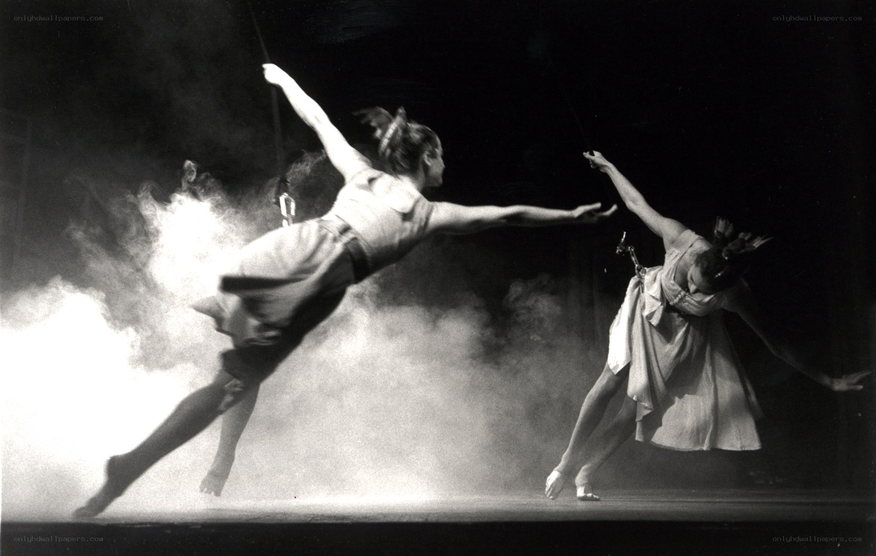 Dancers in smoke on stage
