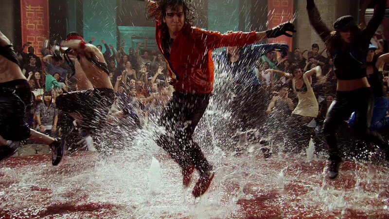 Dancers in water splashing