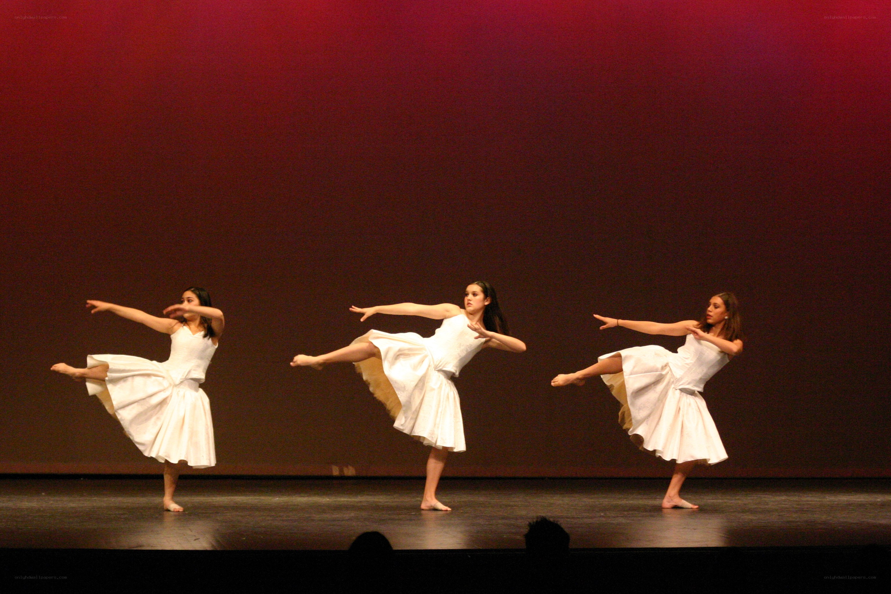 Dancers in white on stage