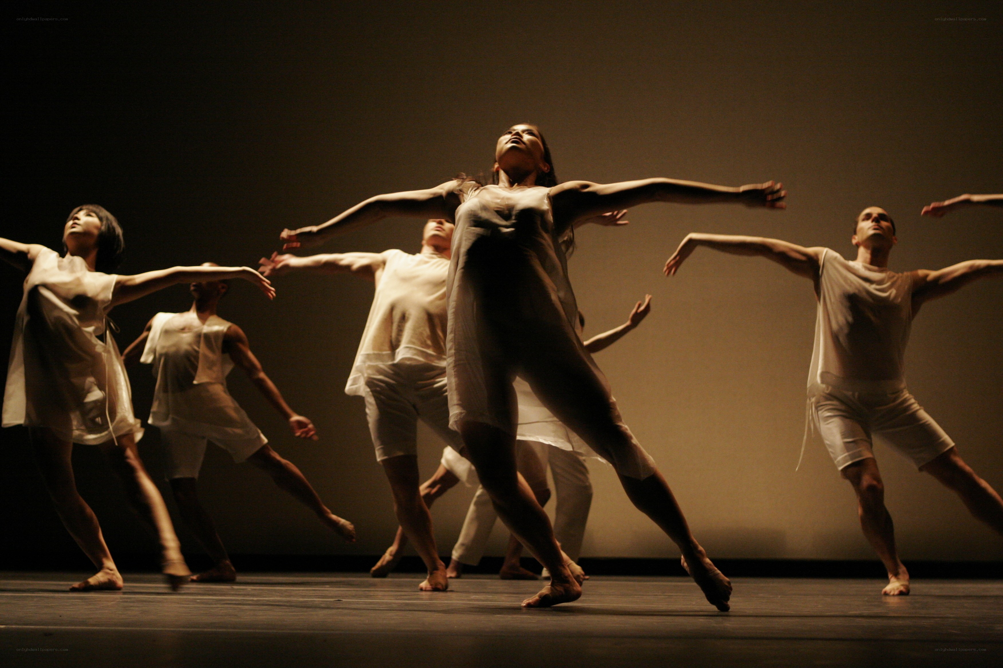 Dancers in white on stage