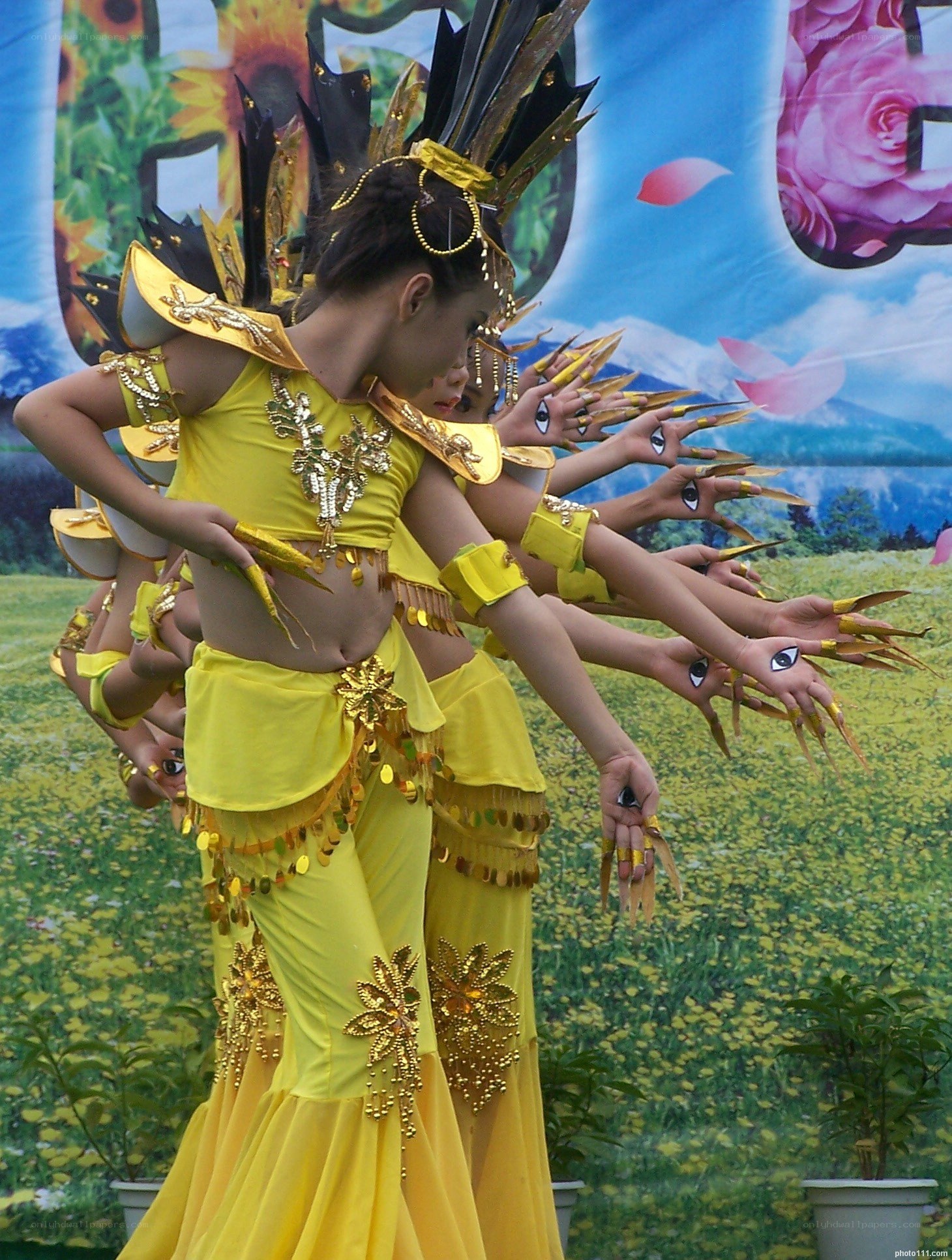 Dancers in yellow costumes